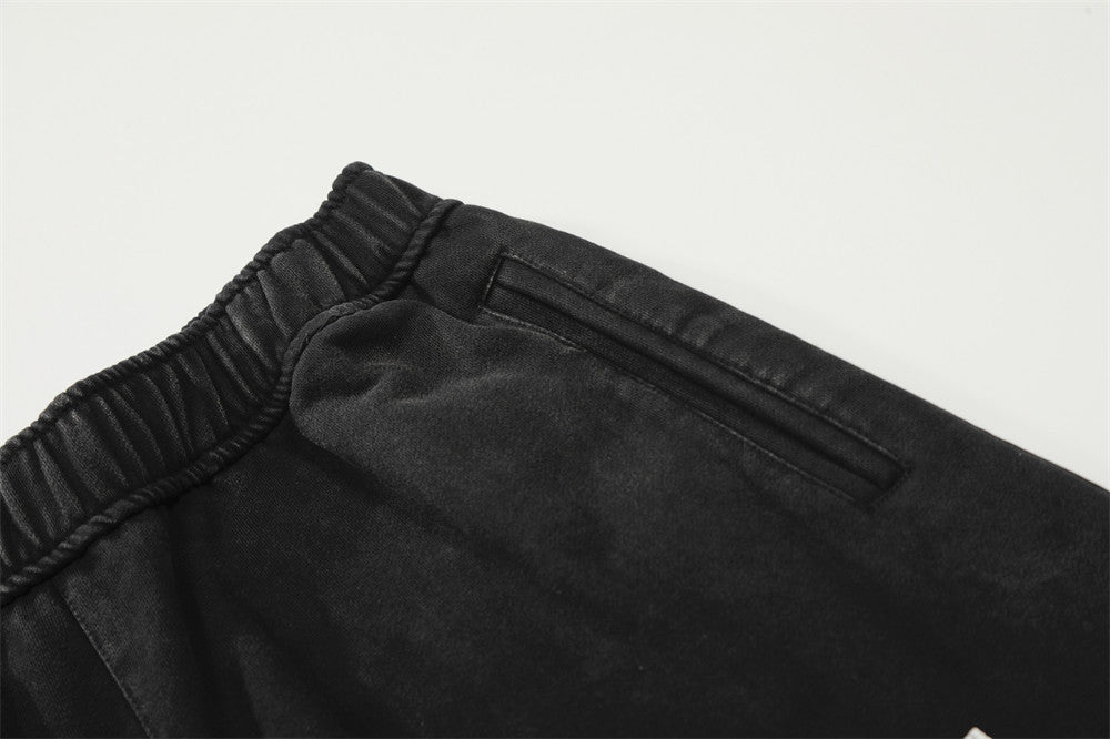 DAXUEN Distressed wide-leg sweatpants with graphic print