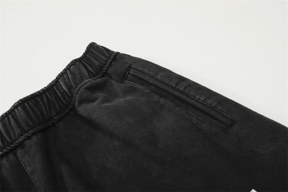 DAXUEN Distressed wide-leg sweatpants with graphic print