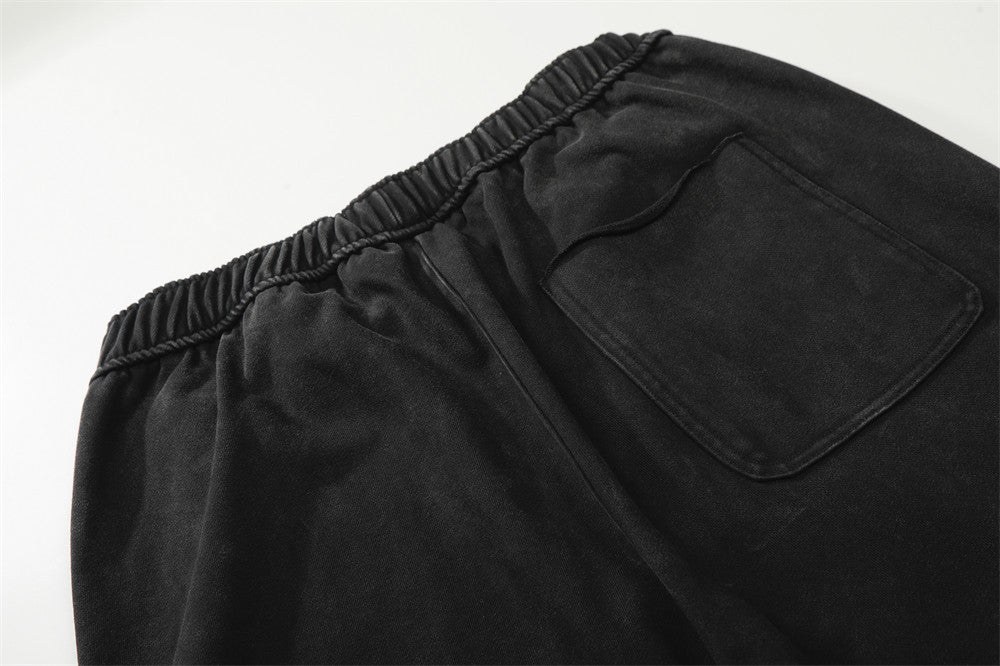 DAXUEN Distressed wide-leg sweatpants with graphic print