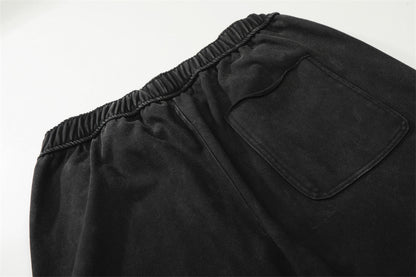 DAXUEN Distressed wide-leg sweatpants with graphic print