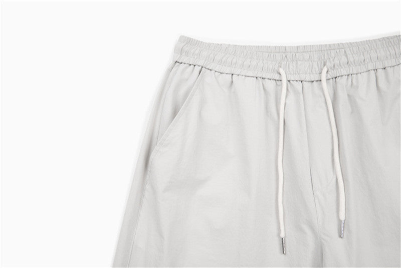 DAXUEN Loose-fitting wide-leg trousers in light grey and black