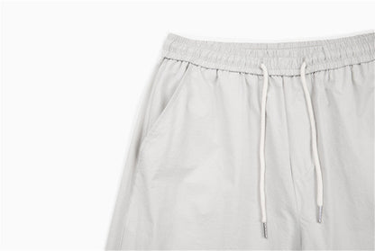 DAXUEN Loose-fitting wide-leg trousers in light grey and black