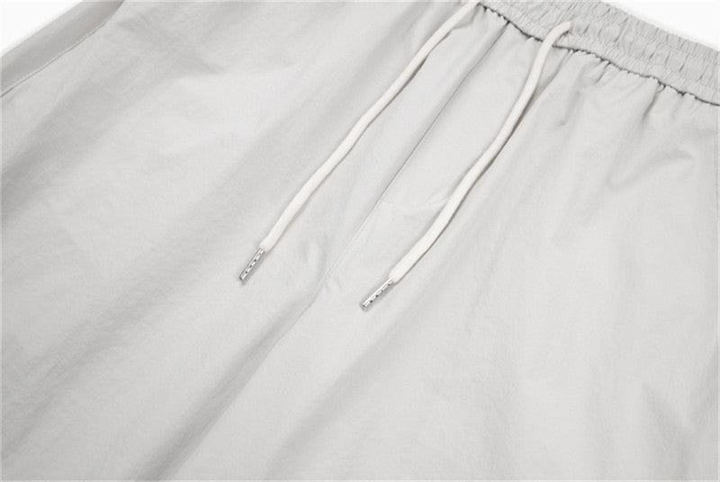 DAXUEN Loose-fitting wide-leg trousers in light grey and black