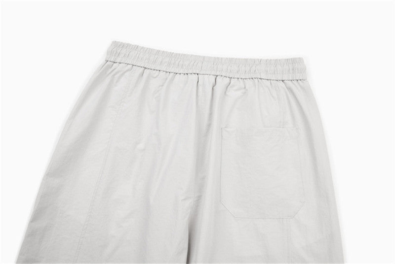 DAXUEN Loose-fitting wide-leg trousers in light grey and black