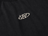 DAXUEN Oversized t-shirt with studded details and abstract logo