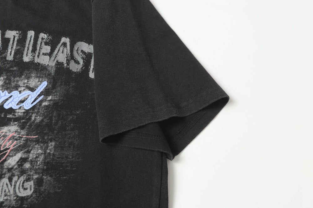 DAXUEN Distressed graphic t-shirt with bold text print