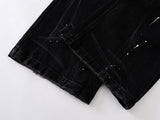 DAXUEN Distressed black wide-leg denim jeans with paint splatters