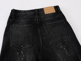 DAXUEN Distressed black wide-leg denim jeans with paint splatters