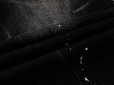 DAXUEN Distressed black wide-leg denim jeans with paint splatters