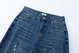 DAXUEN Distressed medium-blue wide leg denim jeans with paint splatters