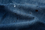 DAXUEN Distressed medium-blue wide leg denim jeans with paint splatters