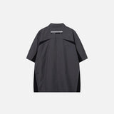 Back view of the gray Splicing Color Zip-up Shirt in a gray background 