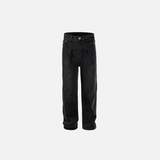Front view of the black Vintage Washed Slim Jeans in a gray background