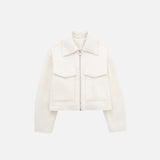 Front view of the white Quilted Utility Jacket in a gray background