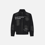 Front view of the black Y2k Washed Old Detroit Jacket in a gray background 
