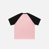 Back view of the pink Raglan Sleeve Contrast Color T-shirt in a gray background 