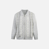 Front view of the gray Cable Knit Zip-Up Sweater in a gray background 