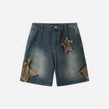 Front view of the blue Vintage Rip Patch Denim Shorts in a gray background