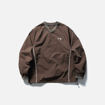 Front view of the brown Metro Breeze Windbreaker Sweatshirt in a gray background