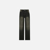 Front view of the black Rebel Thigh-Slash Jeans in a gray background
