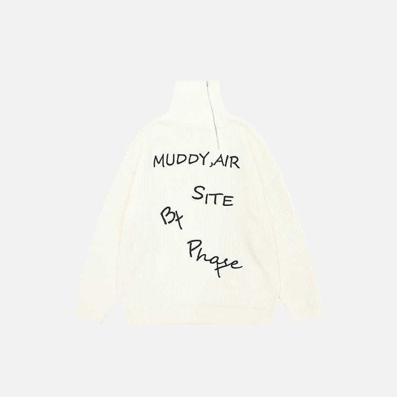 Front view of the beige Y2k Letter Embroidery Oversized Sweater in a gray background 