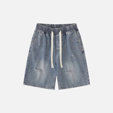 Front view of the blue Relaxed Drawstring Denim Shorts in a gray background