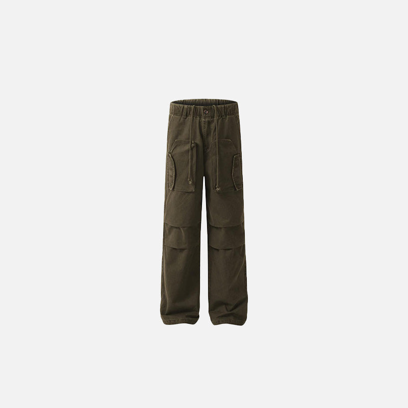 Front view of the brown Tactical Cargo Pocket Jeans in a gray background