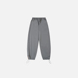 Back view of the gray Y2K Patchwork Joggers Baggy Pants in a gray background