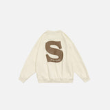 Back view of the beige S Foaming Print Sweatshirt in a gray background