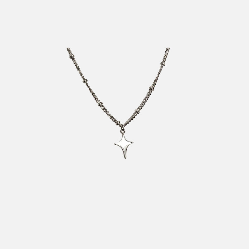 Front view of the Y2K Starburst Necklace in a gray background
