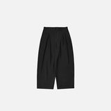 Front view of the black Loose Contrast Color Pants in a gray background 