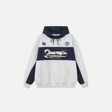 Front view of the grey Retro Vibes Hoodie in a gray background
