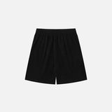 Back view of the black "Refused Change!" Printed Shorts in a gray background 