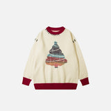 Front view of the apricot Christmas Tree Knitted Sweater in a gray background