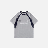 Front view of the gray Loose Racing Patchwork T-shirt in a gray background