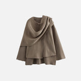 Front view of the brown Versatile Scarf Jacket in a gray background