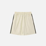 Back view of the beige Side Striped Sports Shorts in a gray background 
