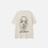 Front view of the beige Faded Face Embroidery T-shirt  in a gray background 