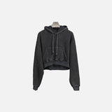 Front view of the black Women's Washed Black Hoodie in a gray background 