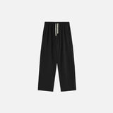Front view of the black Drawstring Wide-Leg Pants in a gray background