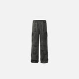 Front view of the grey Rugged Cargo Pants in a gray background