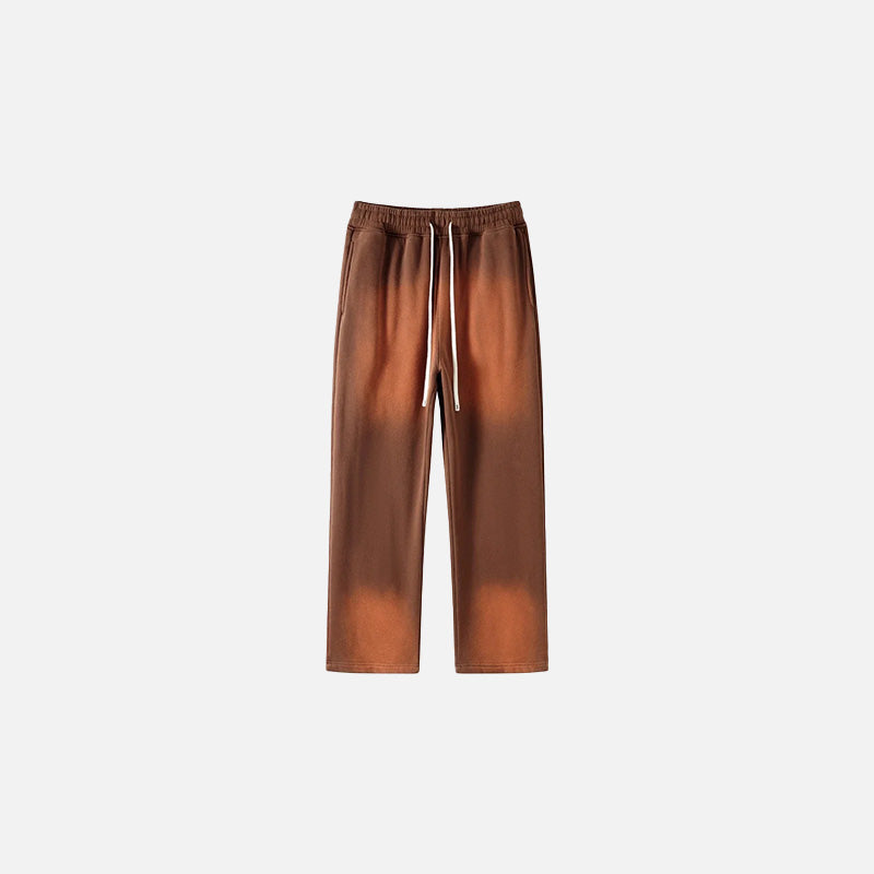 Front view of the brown Casual Noir Relax Pants in a gray background