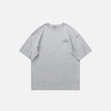 Front view of the grey Loose Short-sleeved Motivate T-Shirt in a gray background 