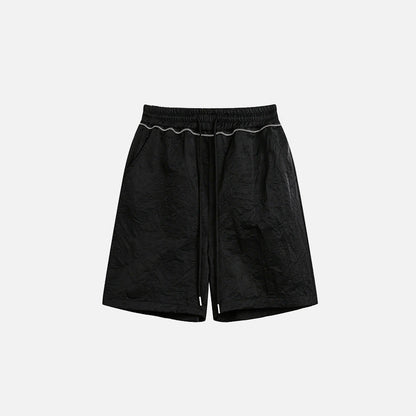 Front view of the black Basic Drawstring Shorts in a gray background 