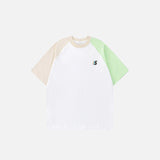 Front view of the white Color Block Retro Patchwork T-shirt in a gray background 