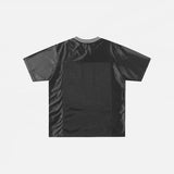 Back view of the black Patchwork Graphic Printed T-Shirt n a gray background
