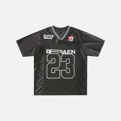 Front view of the black Patchwork Graphic Printed T-Shirt n a gray background