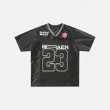 Front view of the black Patchwork Graphic Printed T-Shirt n a gray background