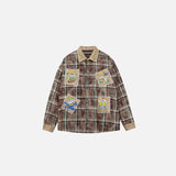 Front view of the brown Vintage-Inspired Graphic Shirt in a gray background