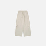 Front view of the apricot Multi Pocket Loose Cargo Pants in a gray background